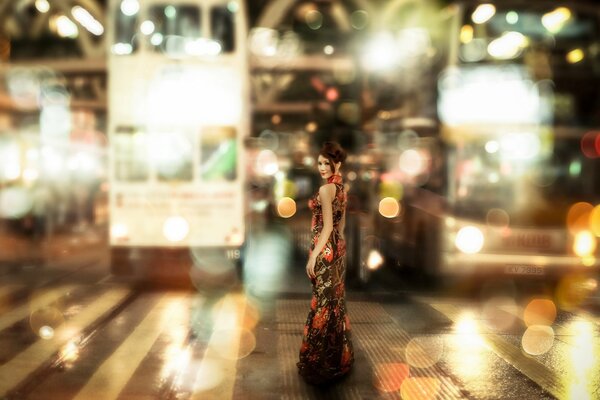 Photo of a girl against the background of street lights