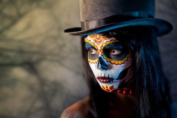 Unusual makeup on a girl in a hat