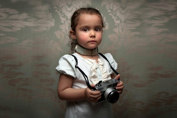 Retro photo of a child with a camera