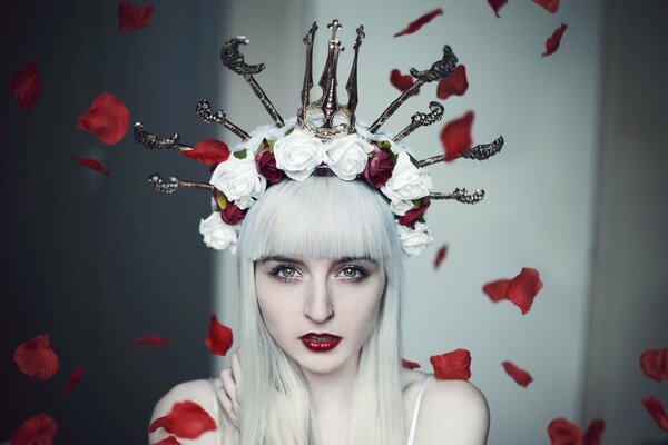 A girl in a wreath of red and white roses