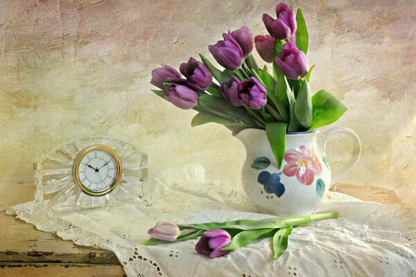 Purple tulips in a vase on the table
