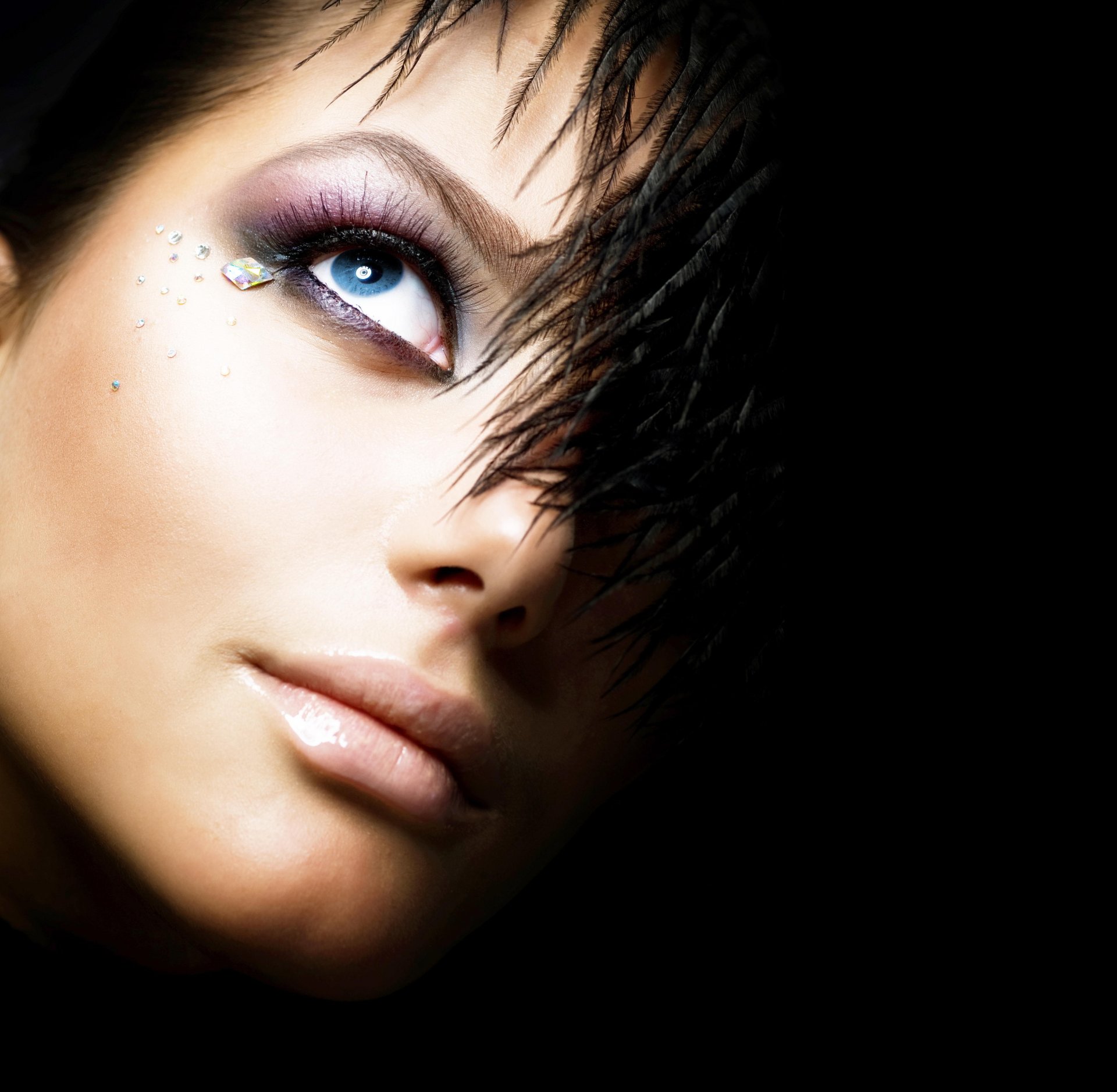 girl black background eye feathers crystals make-up