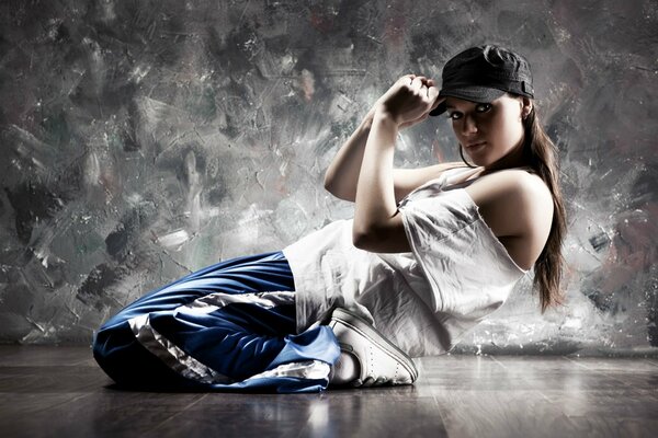 Hip hop dancer sitting on the floor