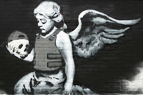 Graffiti of an angel with a skull