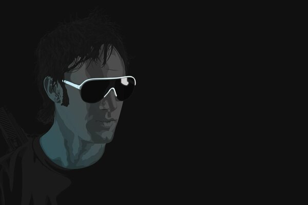 A man with black glasses on a black background