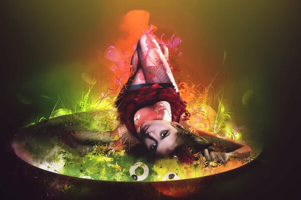 Beautiful girl lying on a colored disk