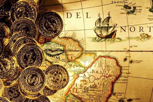 Gold coins lying on the pirate map