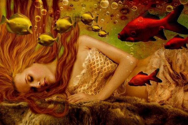 Mermaid with red hair underwater with fish