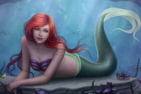 Red-haired mermaid at the bottom of the ocean