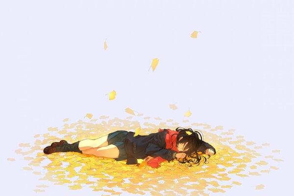 A girl lying on autumn leaves