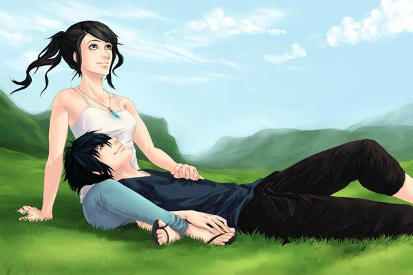Девушка с парнем отдыхают на траве