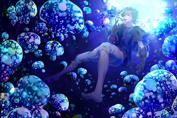 A guy under water among transparent jellyfish blows bubbles