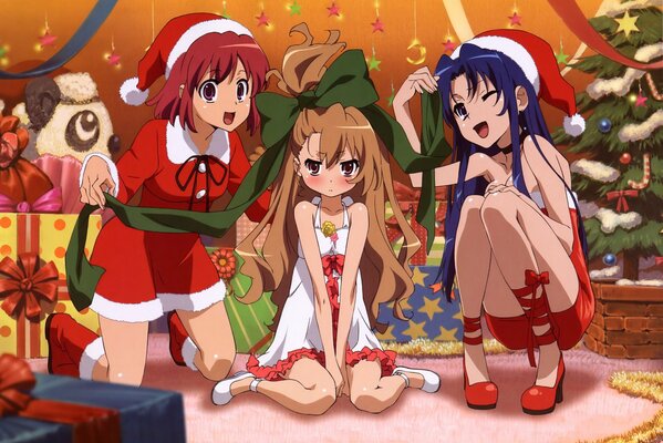 Las niñas desmontan regalos bajo el árbol de Navidad