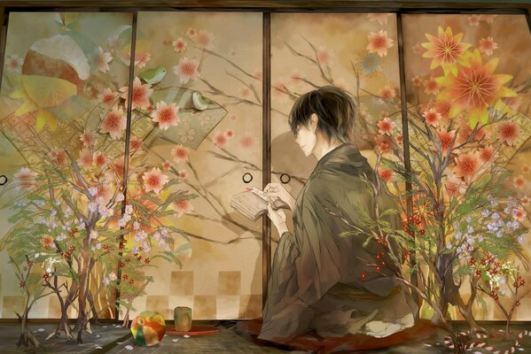 Ragazzo in kimono seduto davanti a uno schermo