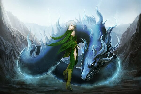 La jeune fille se tient près du dragon parmi les rochers
