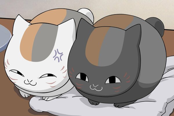 Anime cats are lying next to each other on a pillow