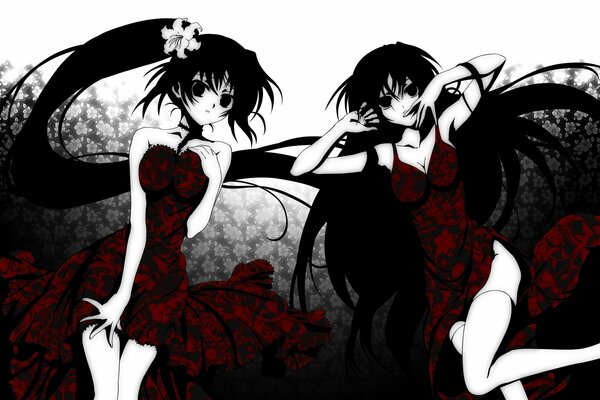 Two girls with black hair in a black and red dress