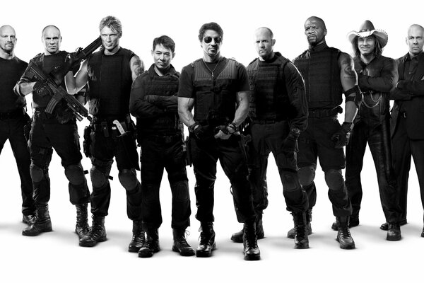 Bruce Willis, Stallone, Stetham in the movie The Expendables