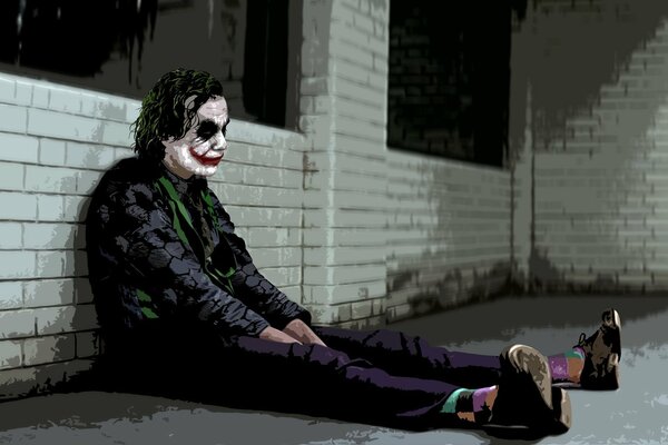 Il triste Joker si siede sul pavimento