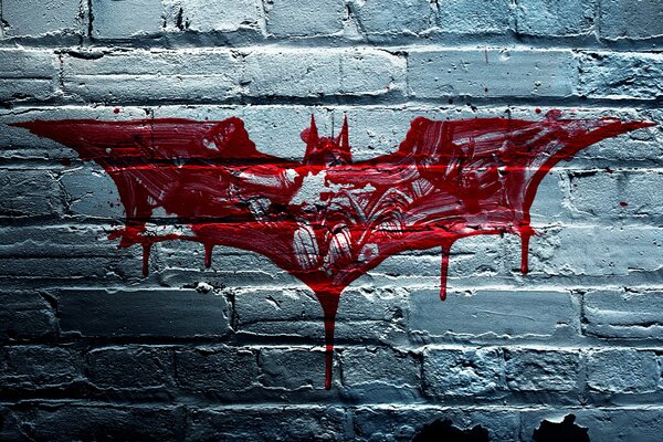 Red batman on a brick back