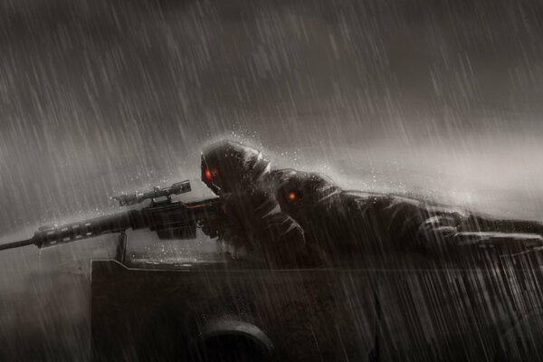 A sniper is lying in the rain in a position with a sniper rifle