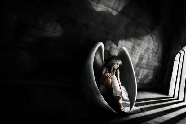 A girl with wings is a prisoner in prison on a black and white background