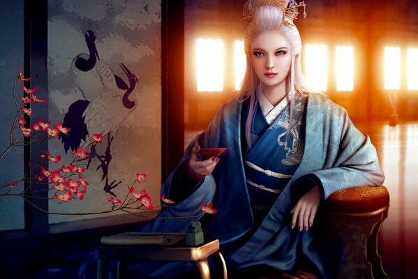 Fille boit du thé en kimono