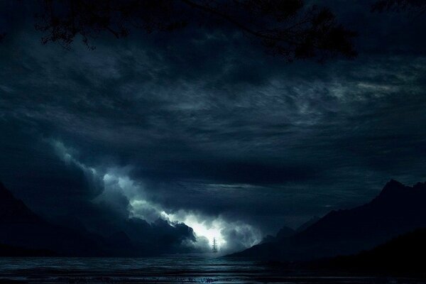 Image of a sailboat in the sea among black clouds