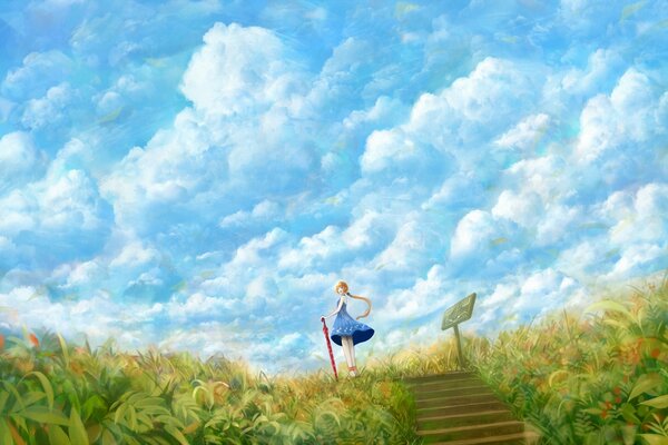 A girl with an umbrella on the background of clouds