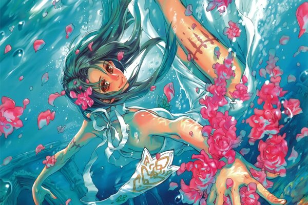 Girl underwater with rose petals