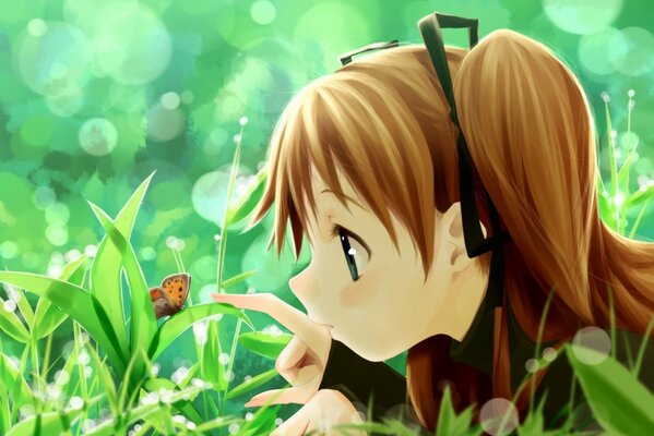 A girl in the grass examines a butterfly