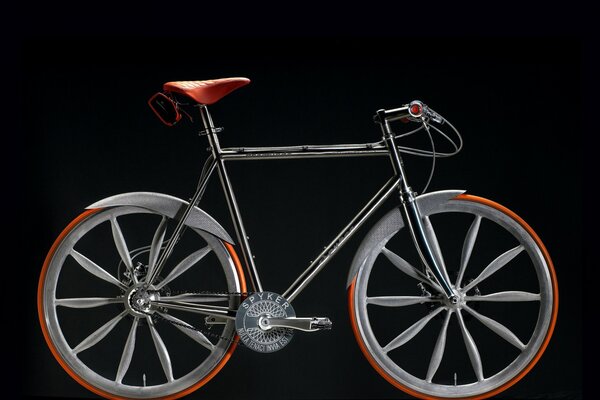 CONCEPTUAL SILVER BIKE ON A BLACK BACKGROUND