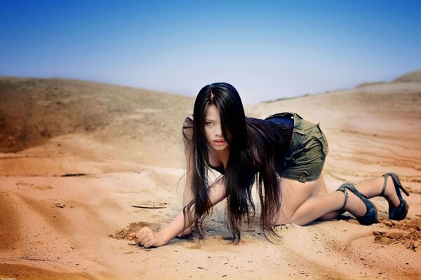 Beautiful brunette from Asia in the desert