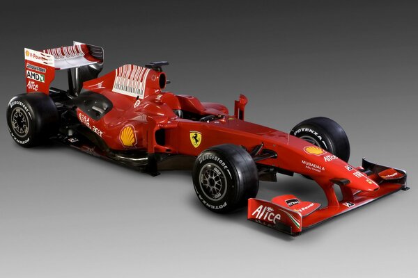 Auto di Formula 1 rossa su sfondo grigio