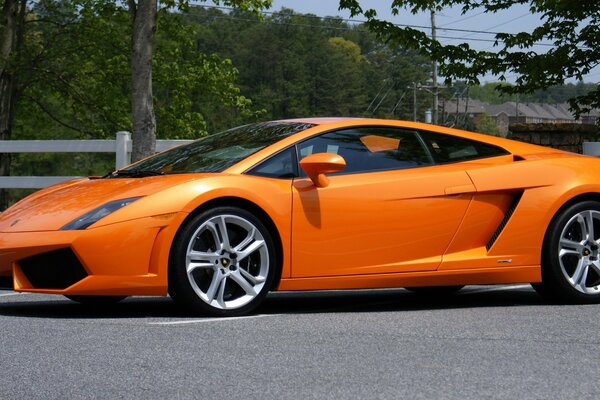 Bright orange lamborghini under the sun