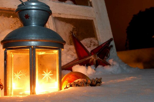 Winter cozy picture with a lantern