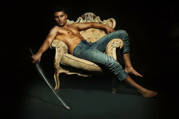 Stylish photo of a male model on a chair