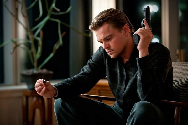 Actor Leonardo DiCaprio with a gun