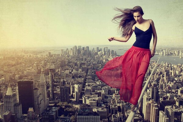 A girl in a red skirt over the city