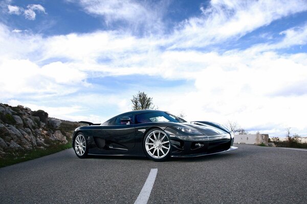 Beautiful car on the sky road background