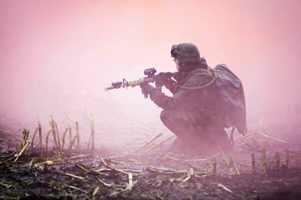 A soldier in full uniform in the fog