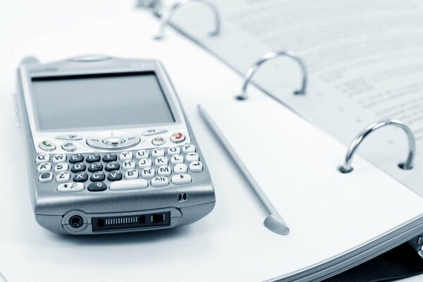 Phone and notepad are irreplaceable attributes of business