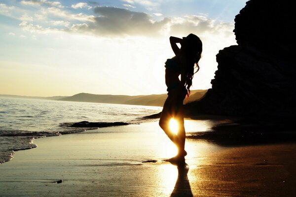 A girl at sunset on the beach