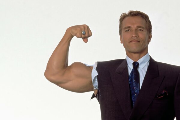 Terminator in a suit shows off his muscles