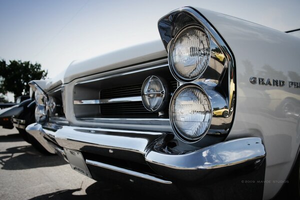 Headlights of an old car with mirror chrome