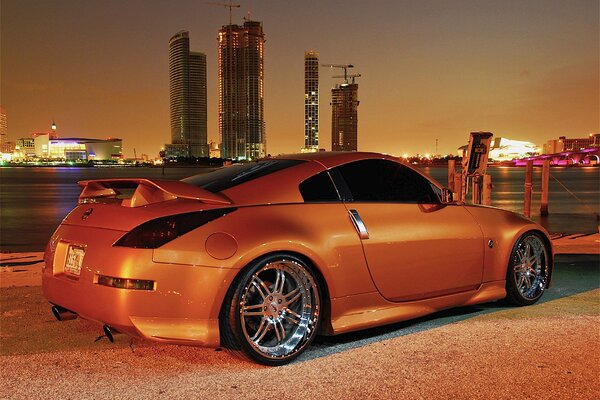 Orange Nissan parked on the dock