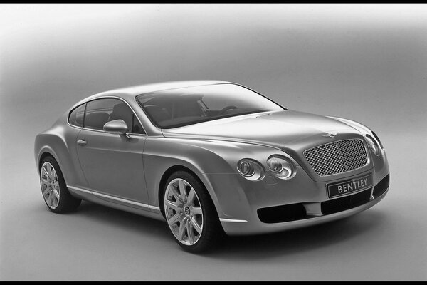 Black and white photo of a bentley car with the same name background