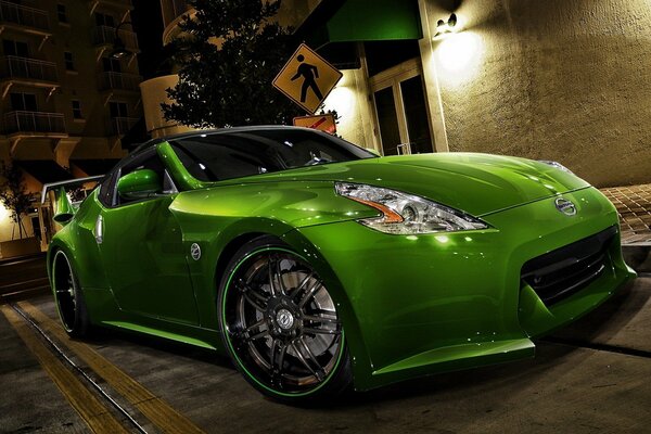 A wonderful apple-green Nissan fits into an urban setting