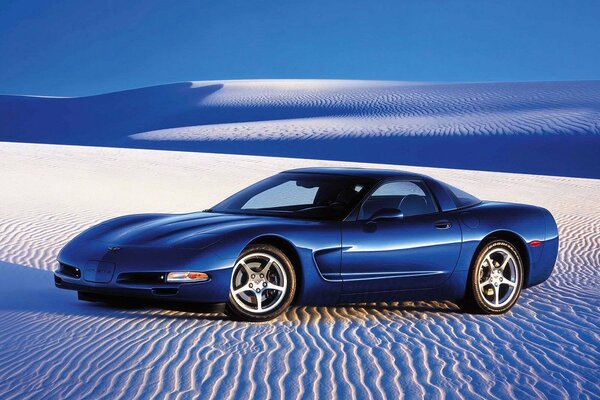 Desert, sand on which there is a charming car