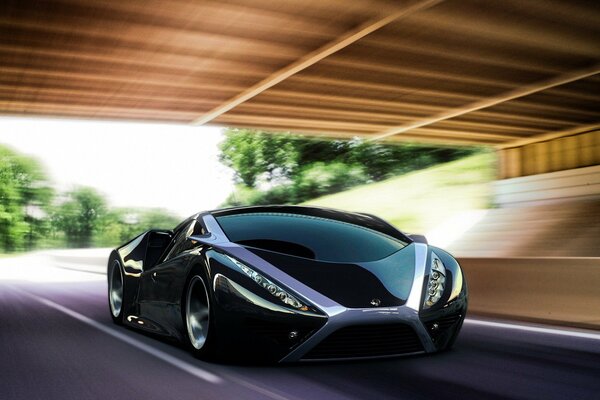 Sports car under the bridge at high speed